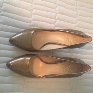 Gold patent leather Vince Canute shoes.